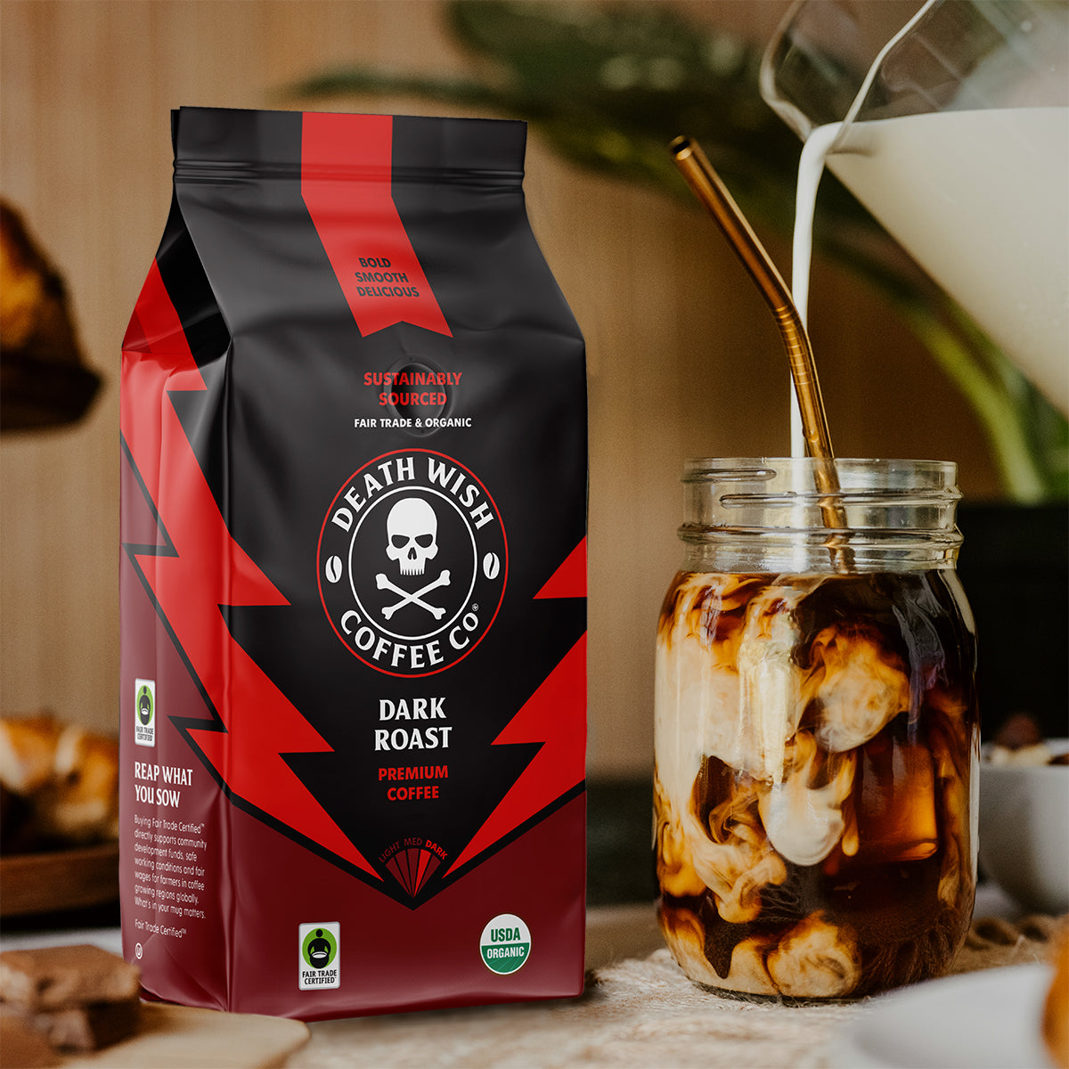 Pouring creamer into a cup of Dark Roast Death Wish Coffee.