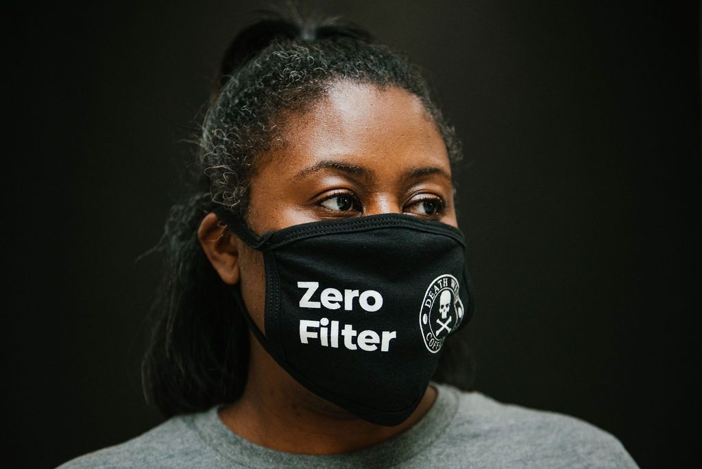 Woman wearing Death Wish 'Zero Filter' Face Covering