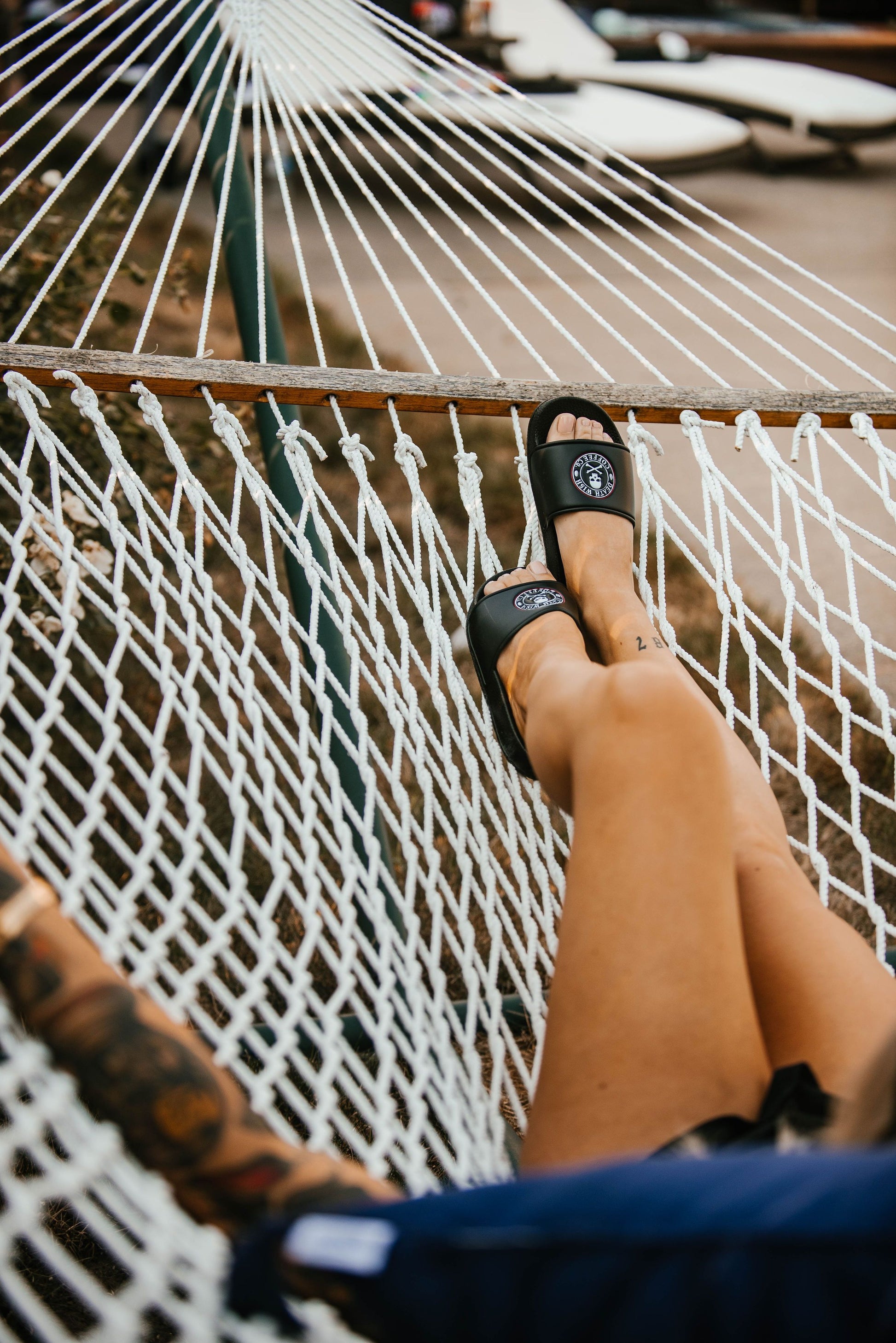 Woman wearing Death Wish Coffee Premium Slides