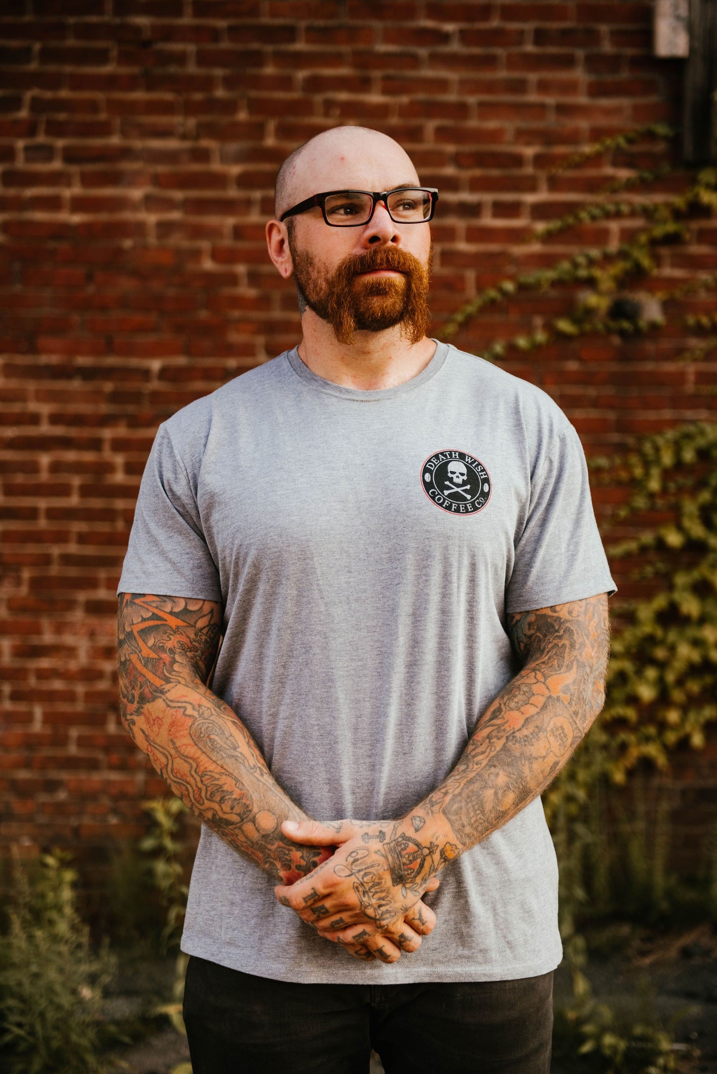 Man wearing a "Broke, Not Busted" Charity T-shirts