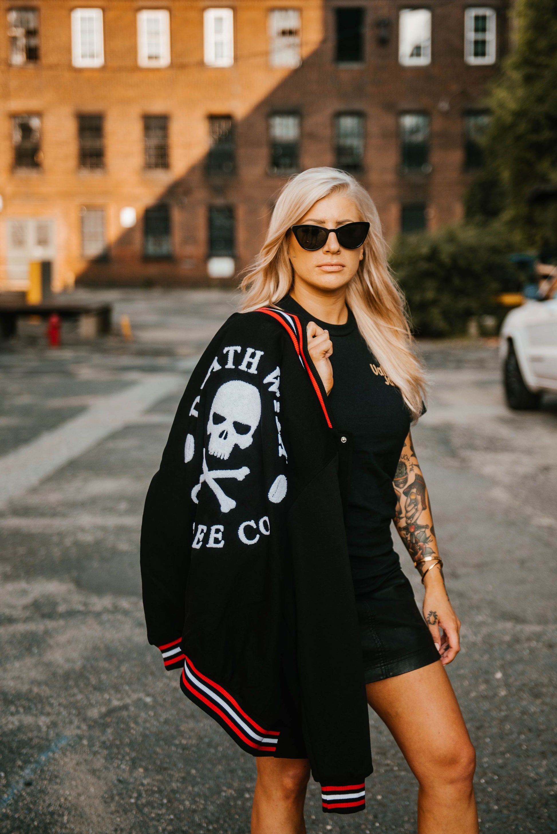 Woman with Death Wish Letterman Jacket on her shoulder