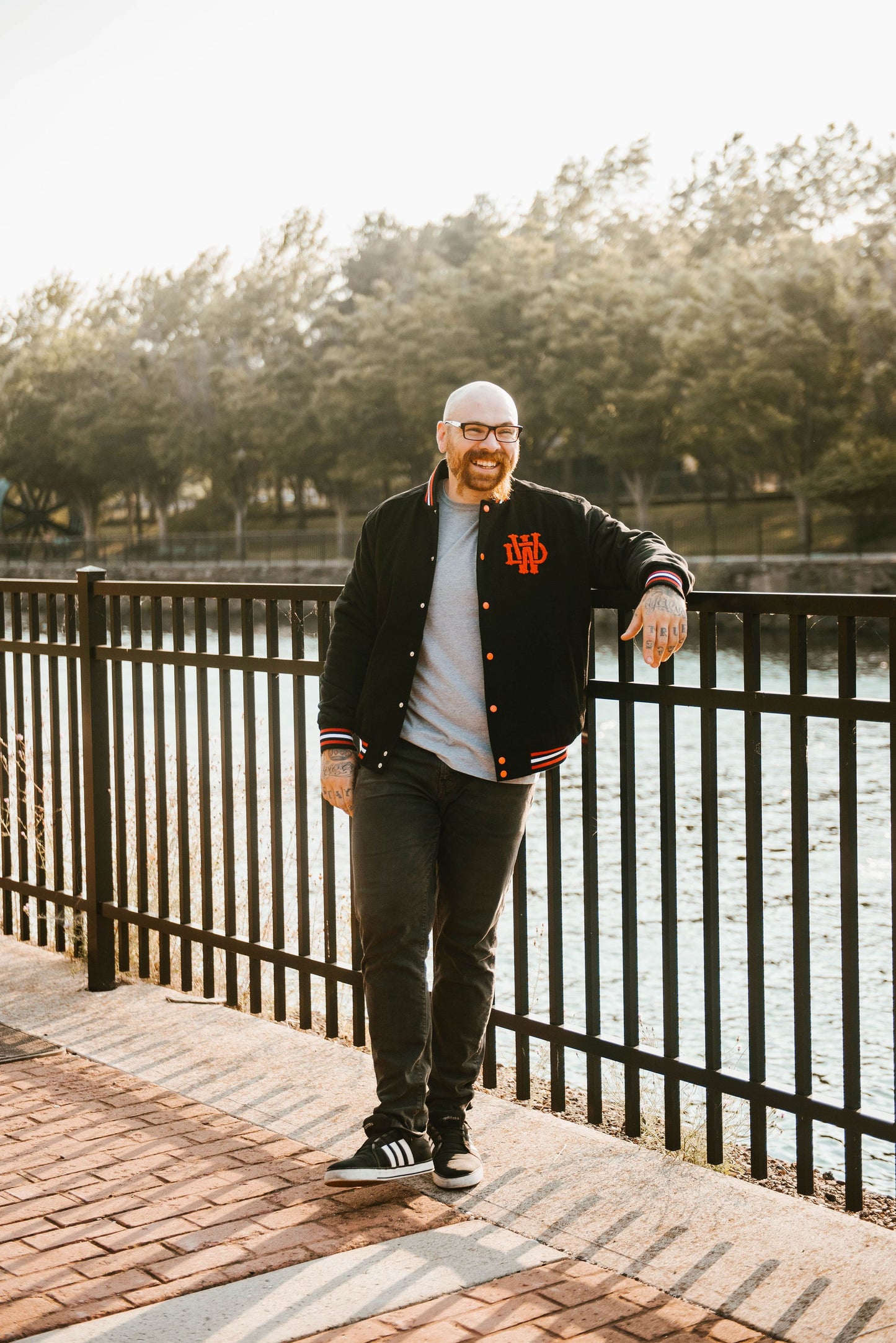 Full shot of man wearing Death Wish Letterman Jacket