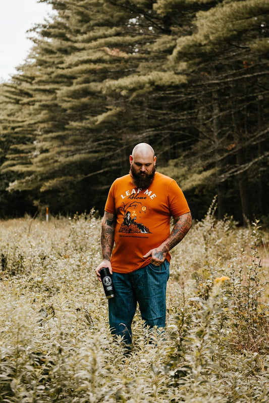 Man wearing Leaf Me Alone T-shirt